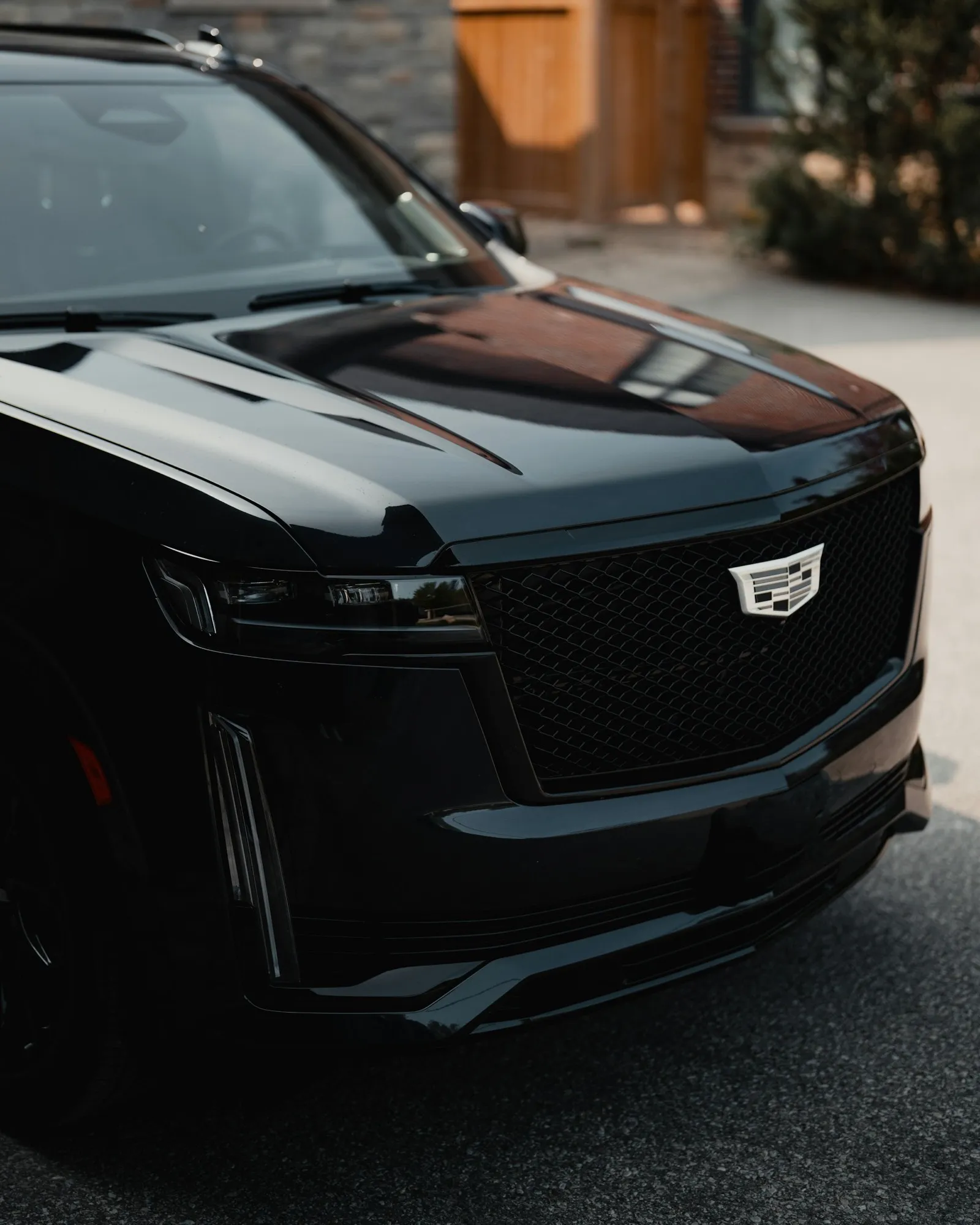 Close-up of the black Cadillac Escalade hood and grille